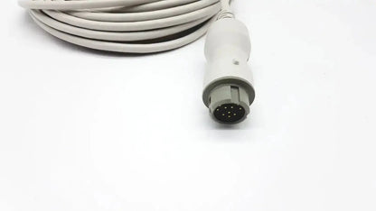 A coiled white medical reusable bare copper wire ibp cable with a gray connector housing and nine black pins