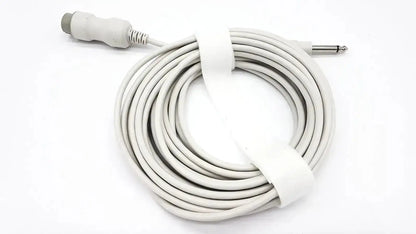 White coiled ibp cable with reusable bare copper wire, gray connector, and silver 6.35mm plug secured by white strap