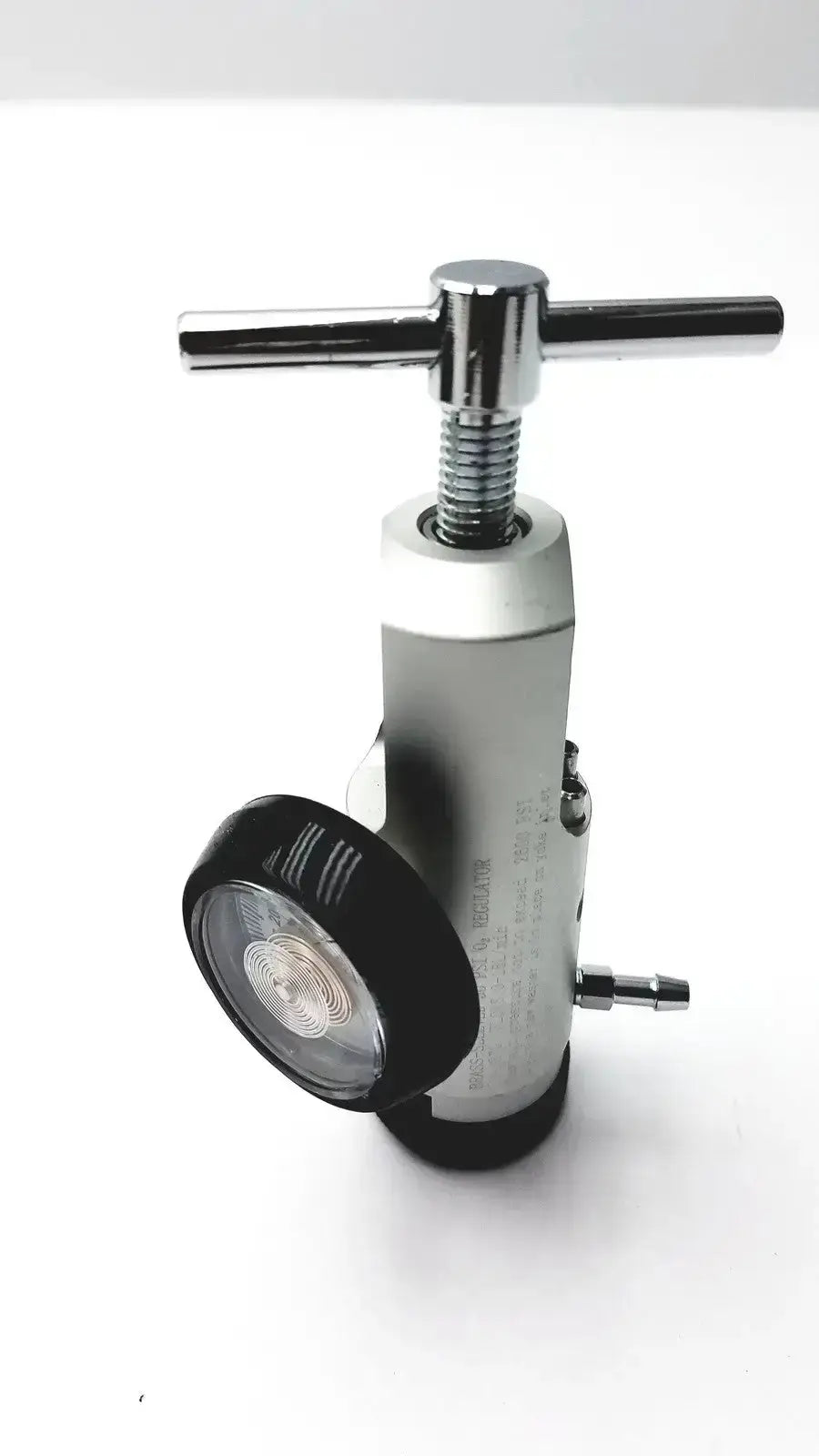 Silver metallic medline brass-sleeved psi o2 regulator with black pressure gauge and chrome handle for hospital surplus use