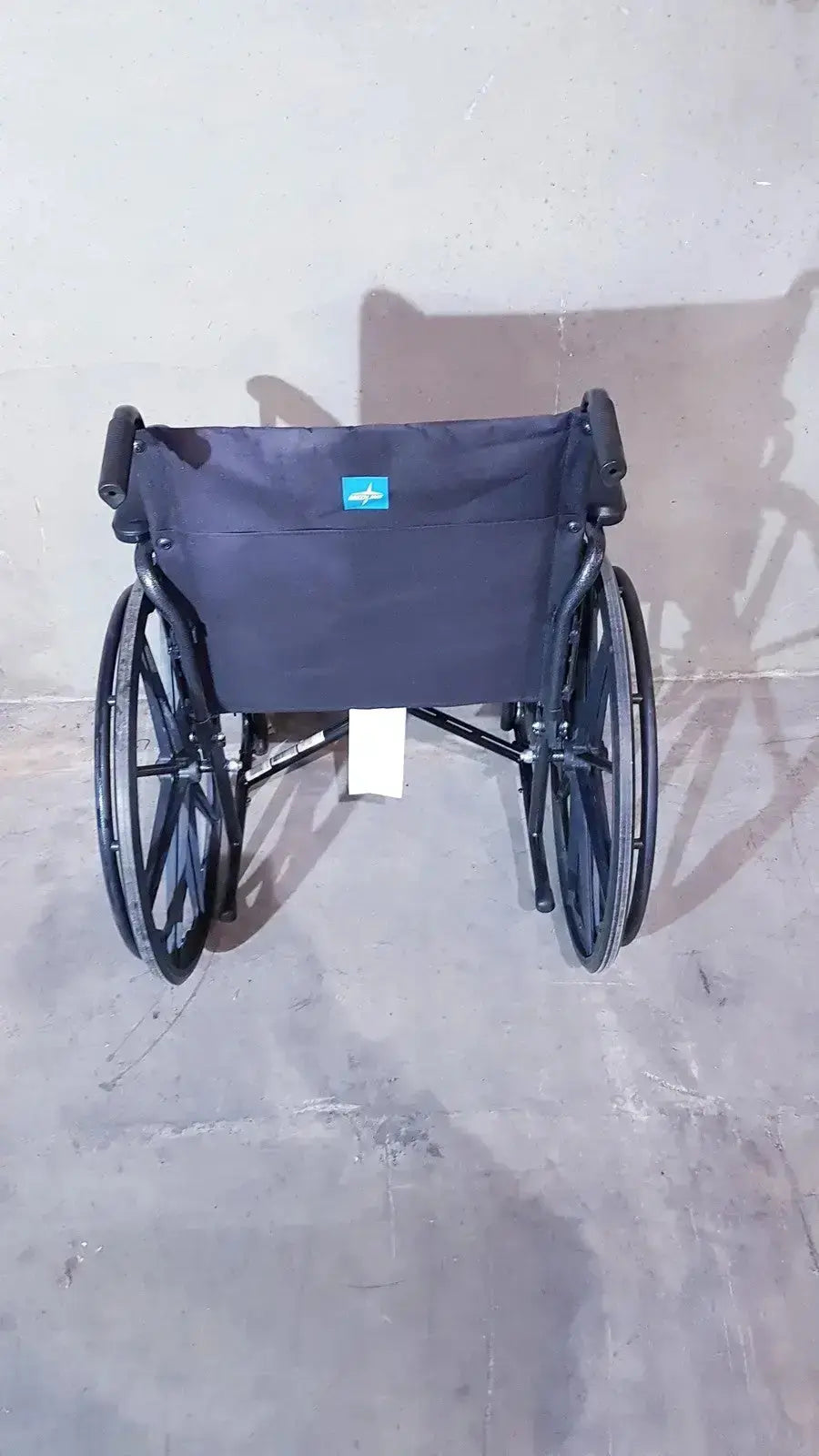 Medline guardian k1 lightweight wheelchair compact with black metal frame and dark navy fabric seat ready to use