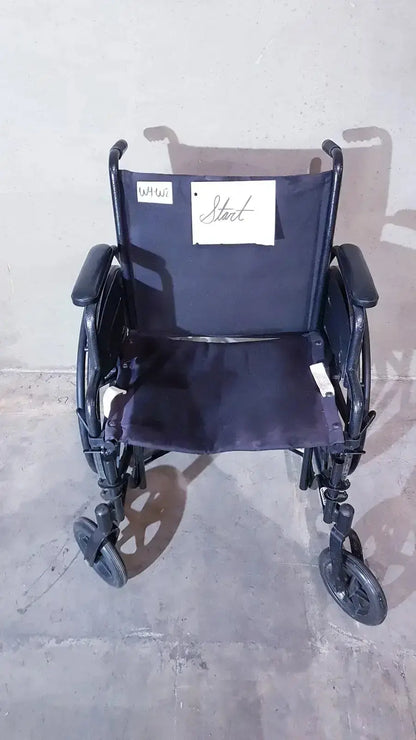 Black metal guardian k1 lightweight wheelchair with dark blue fabric compact seat and handwritten note on backrest