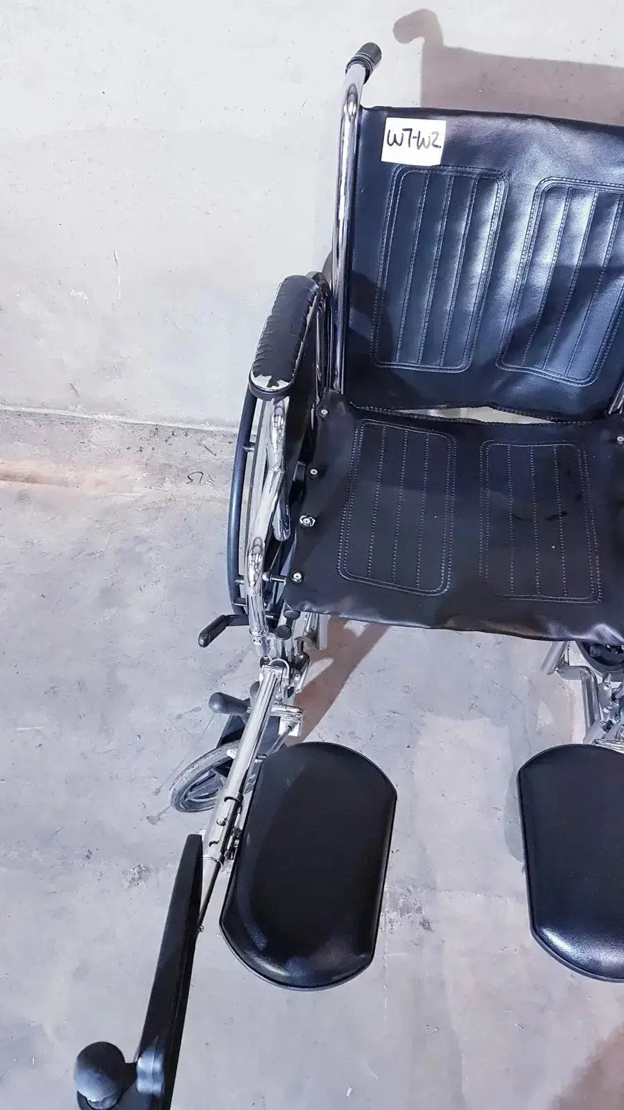 Black leather-seated manual wheelchair with chrome frame and footrests medline k1206n22e manual model for adult use