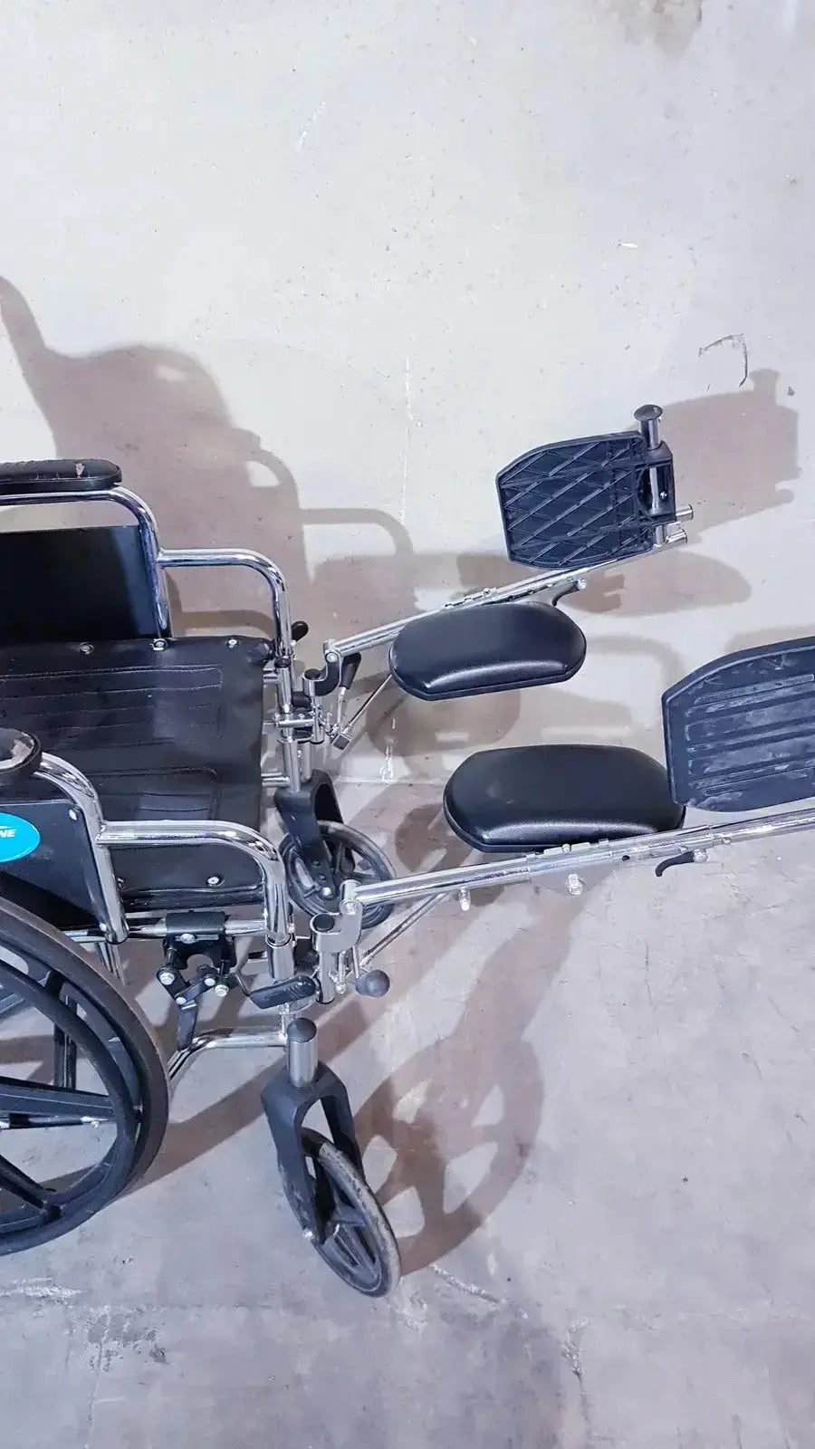 Black and silver medline k1206n22e manual wheelchair with adjustable footrests and padded seat cushions for adults