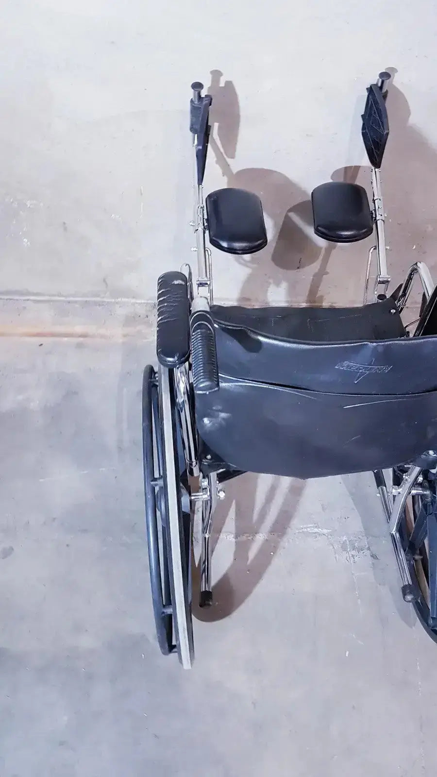 Black leatherette manual wheelchair with chrome frame and adjustable footrests medline k1206n22e manual model