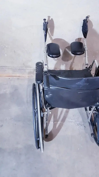 Black leatherette manual wheelchair with chrome frame and adjustable footrests medline k1206n22e manual model
