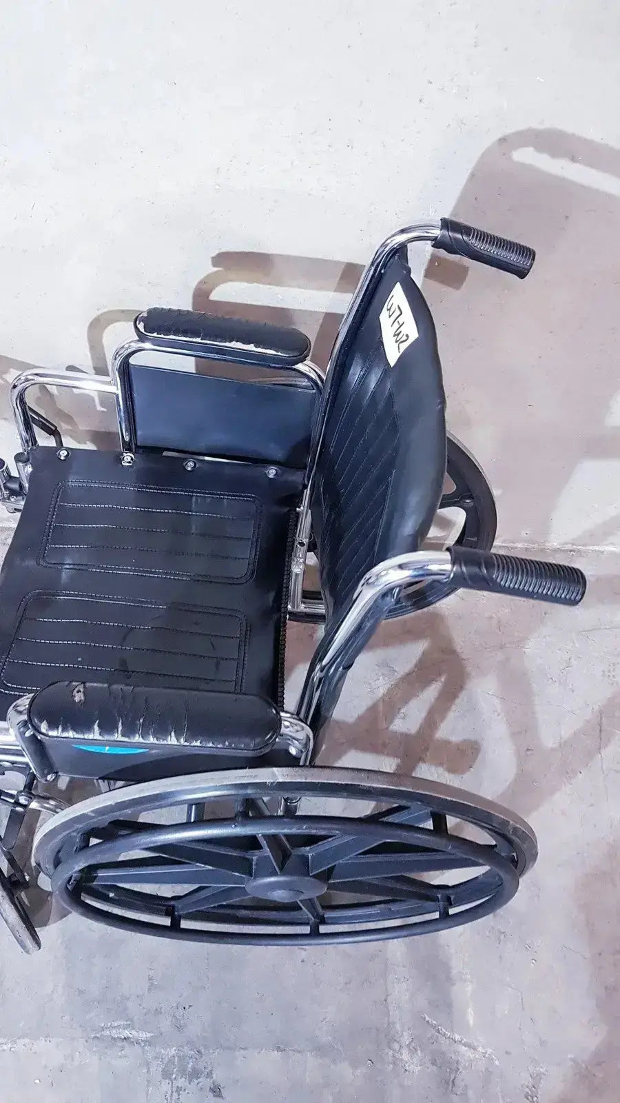 Black leatherette manual wheelchair with chrome frame and black rubber tires medline k1206n22e manual model