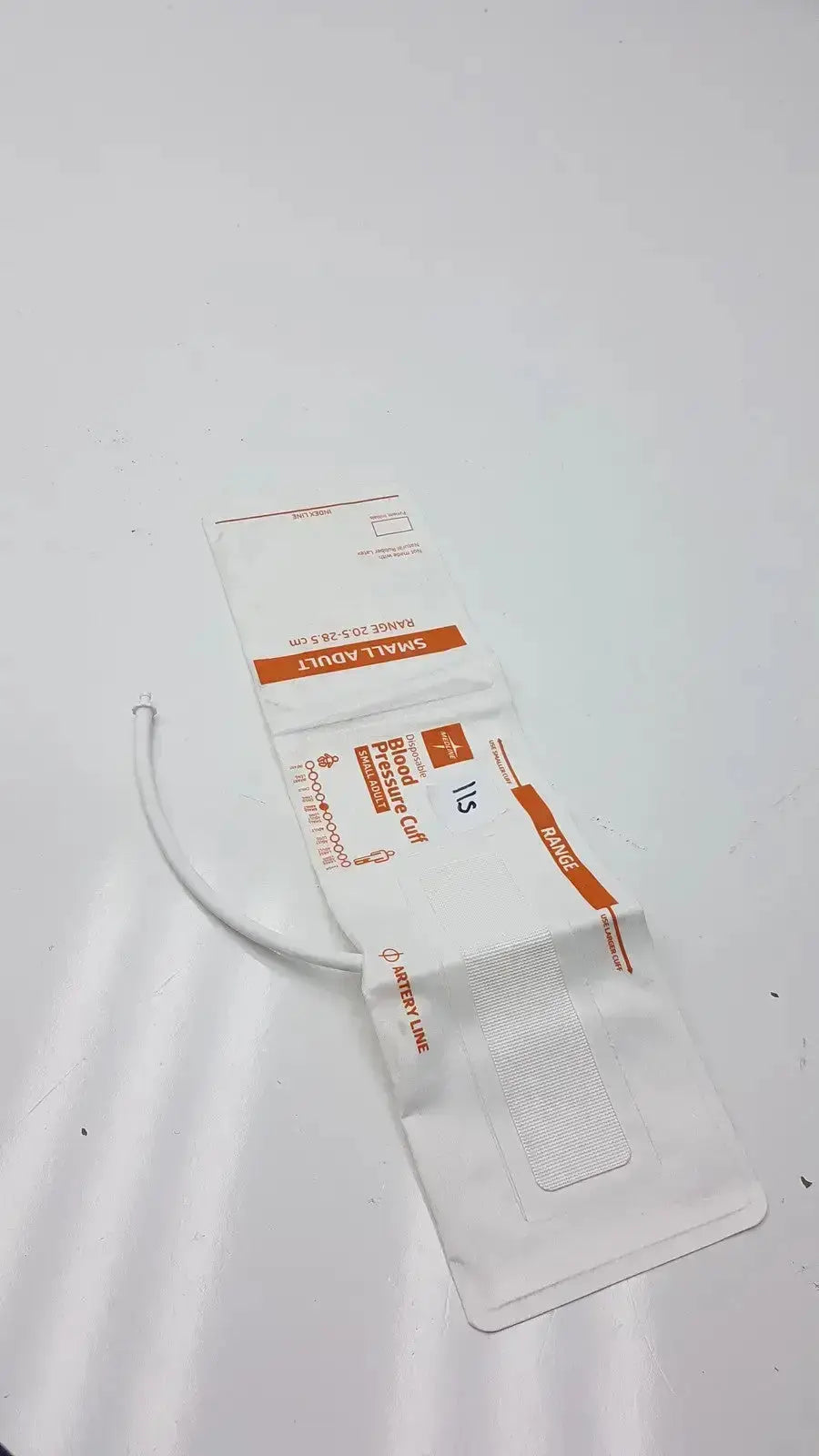 White plastic medline small adult blood pressure cuff bag with orange labeling and clear window for adult use