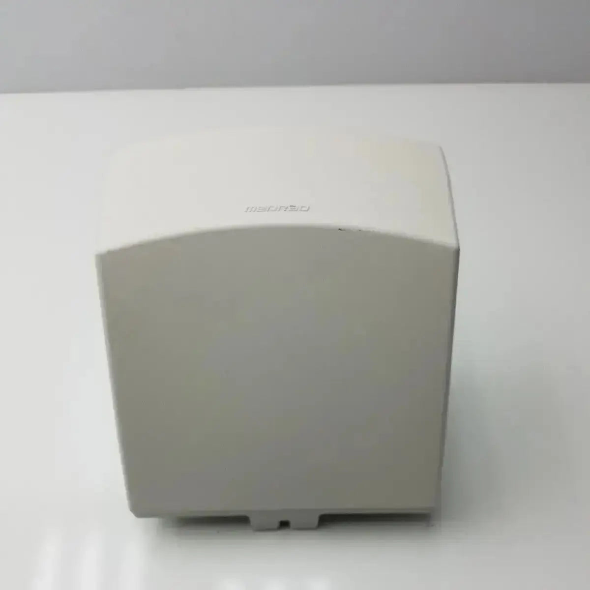 Off-white plastic hand dryer with sleek rectangular design and rounded edges in medrad stellant ct power supply unit