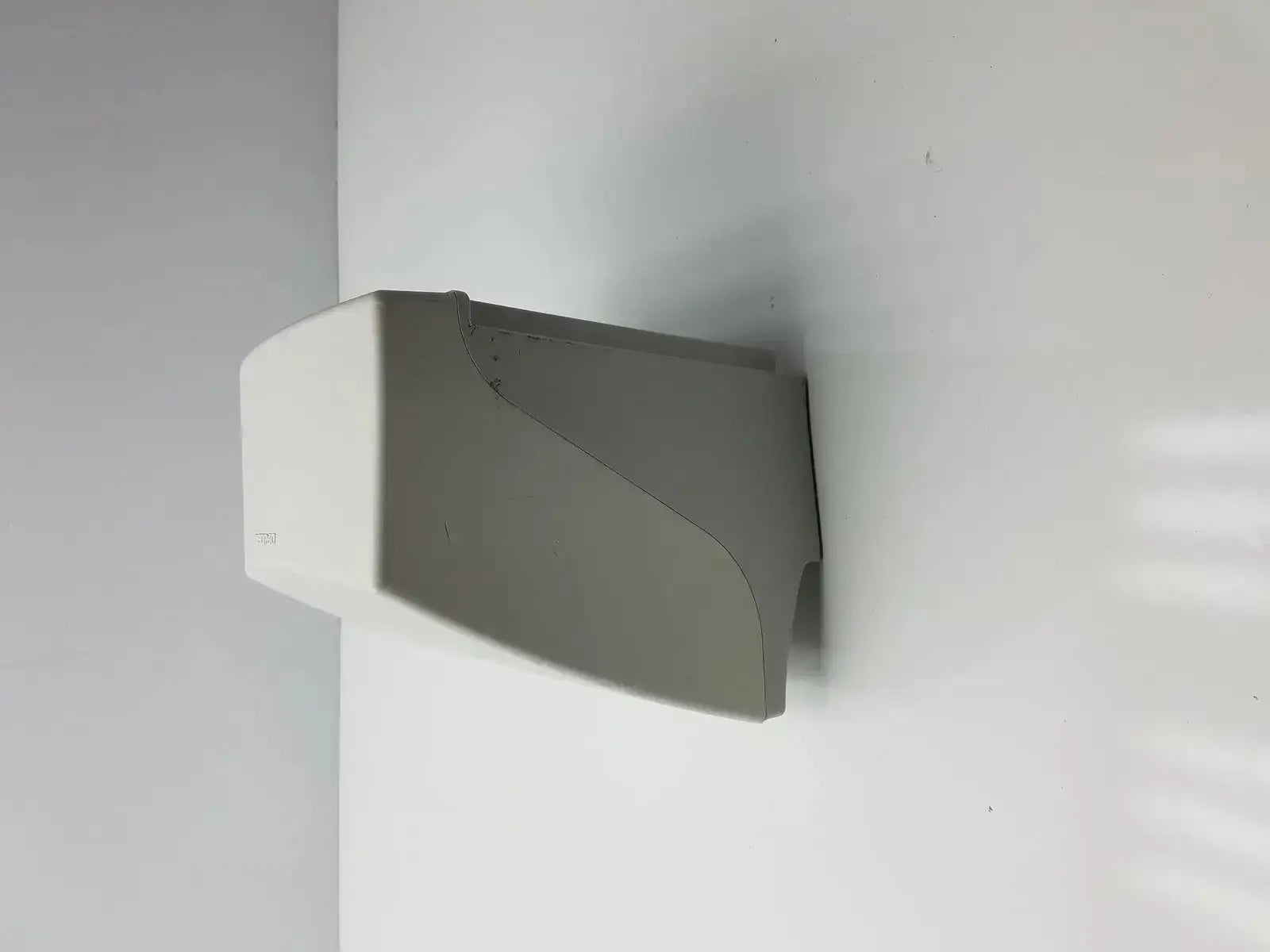 White wall-mounted hand dryer with sleek plastic finish designed for medrad stellant ct power supply use