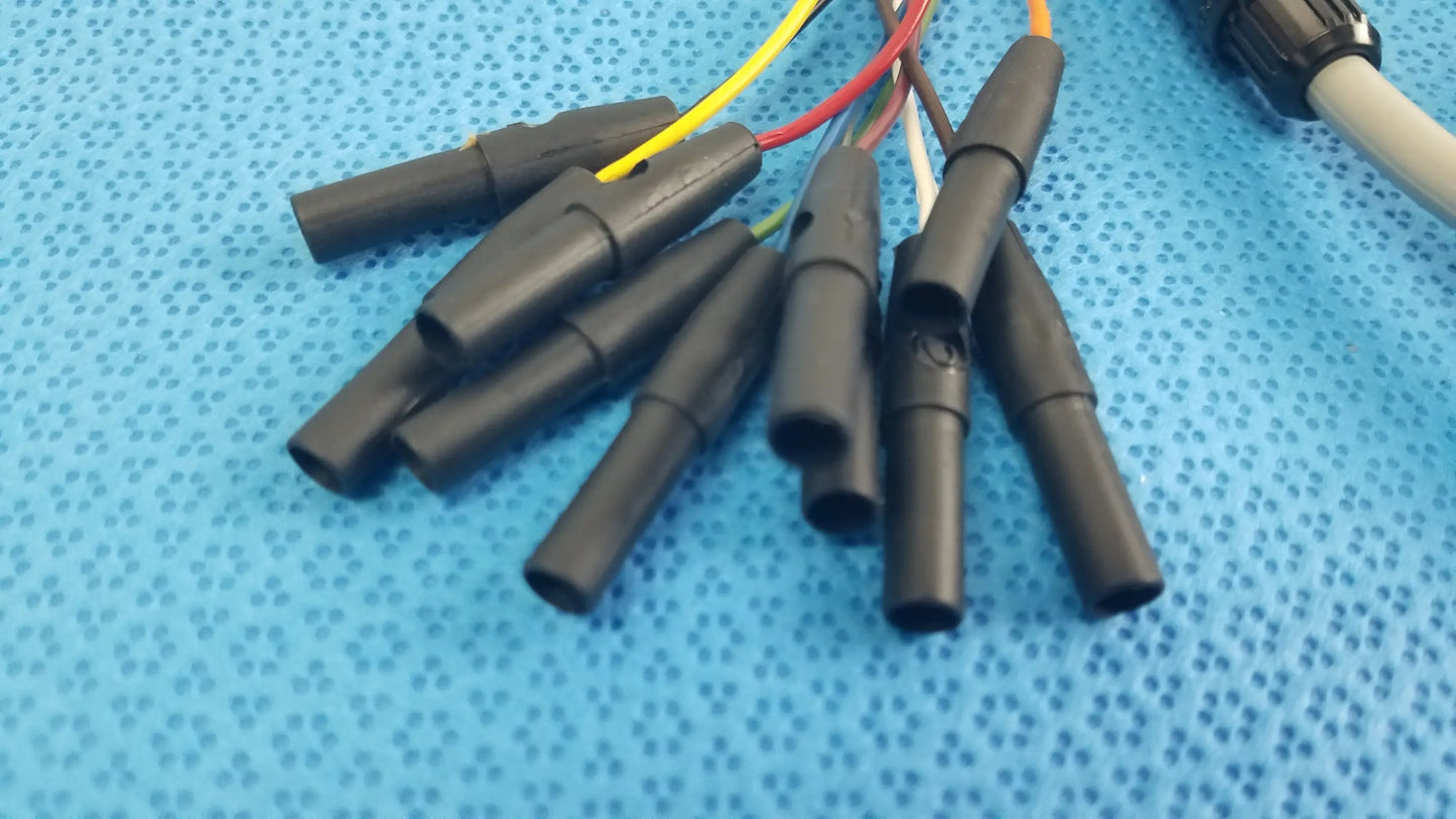 Black plastic electrical connectors with colored wires on the back side of medtronic 2achc catheter ecg cable medical equipment