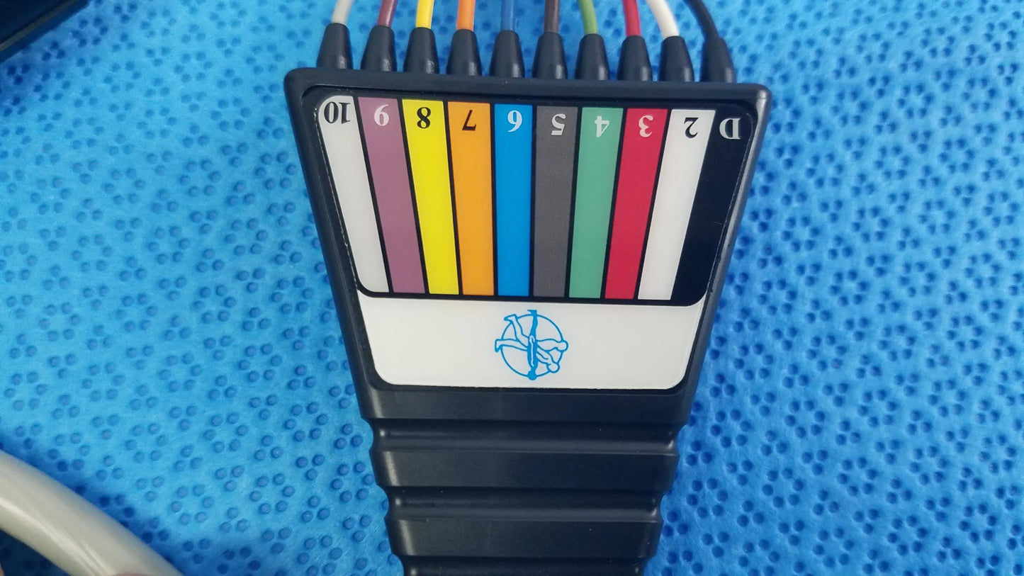 Black plastic ethernet cable tester with color-coded ports and blue logo for medtronic 2achc catheter ecg medical equipment
