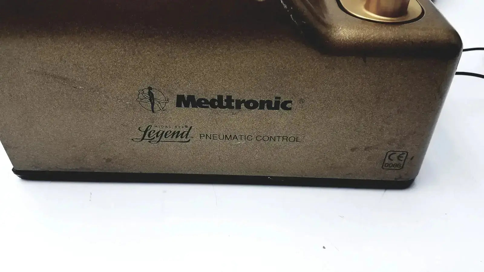 Medtronic c6774-12 midas rex legend gold pneumatic control device with matte bronze casing and gold-toned accents