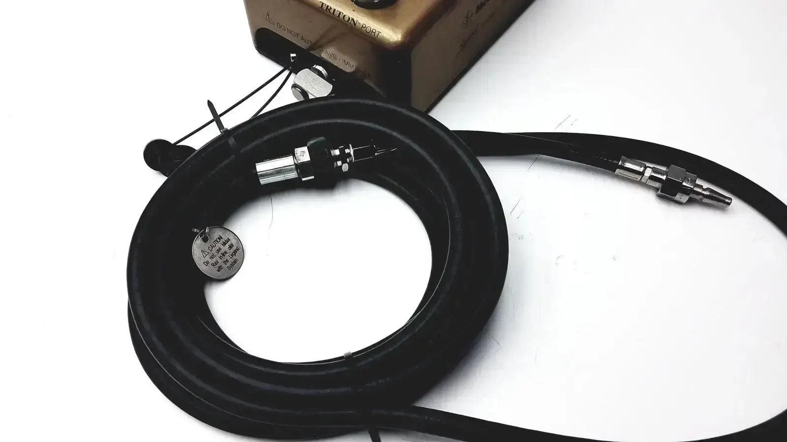 Black coiled cable with metallic connectors and circular metal tag for medtronic midas rex legend gold pneumatic model c6774-12