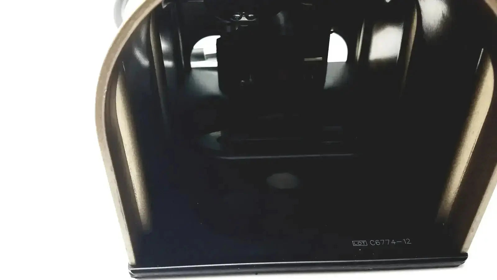Black plastic tissue box with gold-colored trim featured with midas rex legend gold pneumatic design details