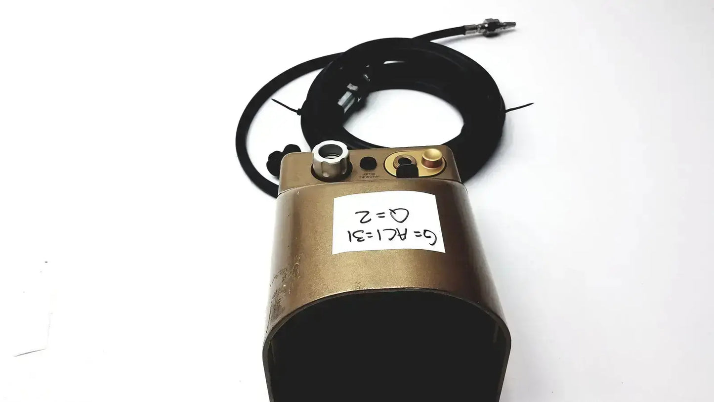 Bronze midas rex legend gold pneumatic device with metallic fittings and coiled black cable featuring handwritten label