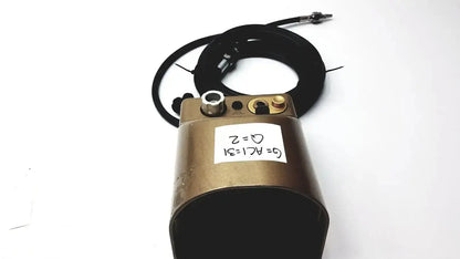 Bronze midas rex legend gold pneumatic device with metallic fittings and coiled black cable featuring handwritten label