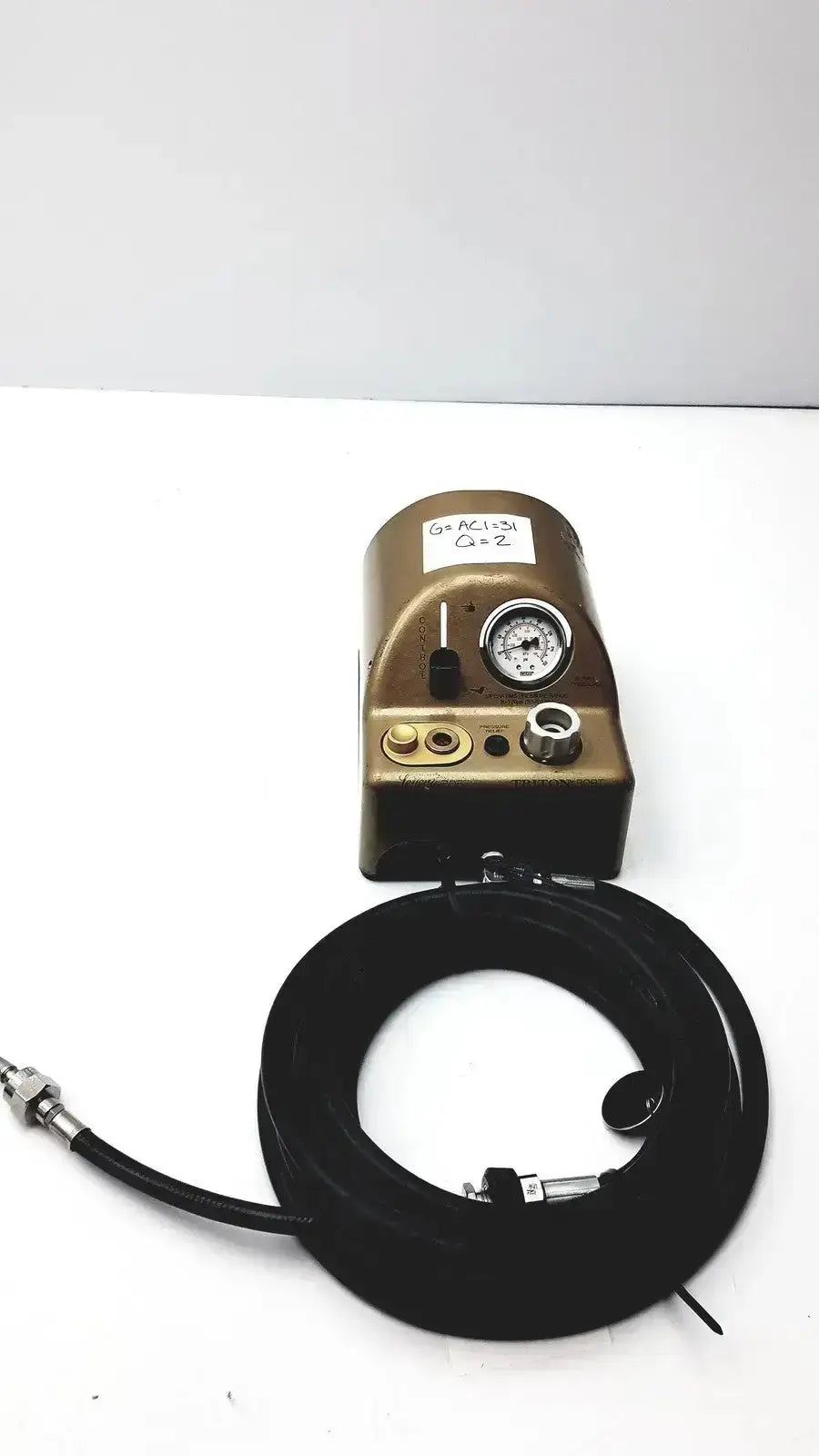 Bronze-colored midas rex legend gold pneumatic air compressor with black coiled hose and pressure gauge medtronic c6774-12