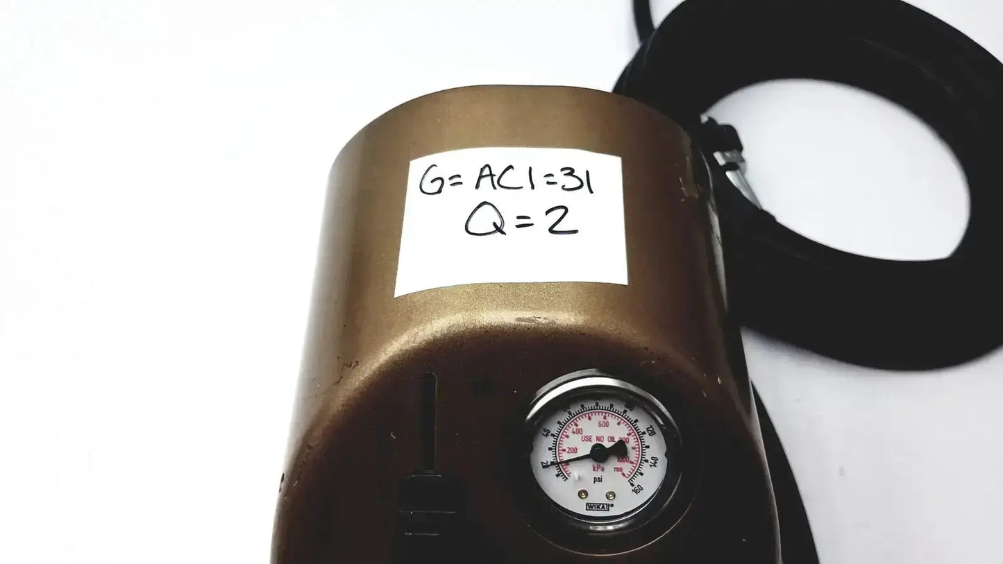 Bronze midas rex legend gold pneumatic pressure gauge with white label and black markings for precise measurement