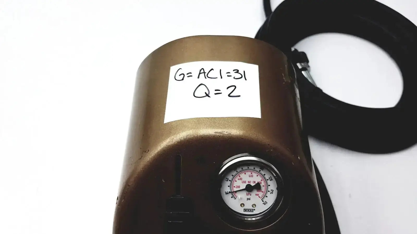 Bronze midas rex legend gold pneumatic pressure gauge with white label and black markings for precise measurement