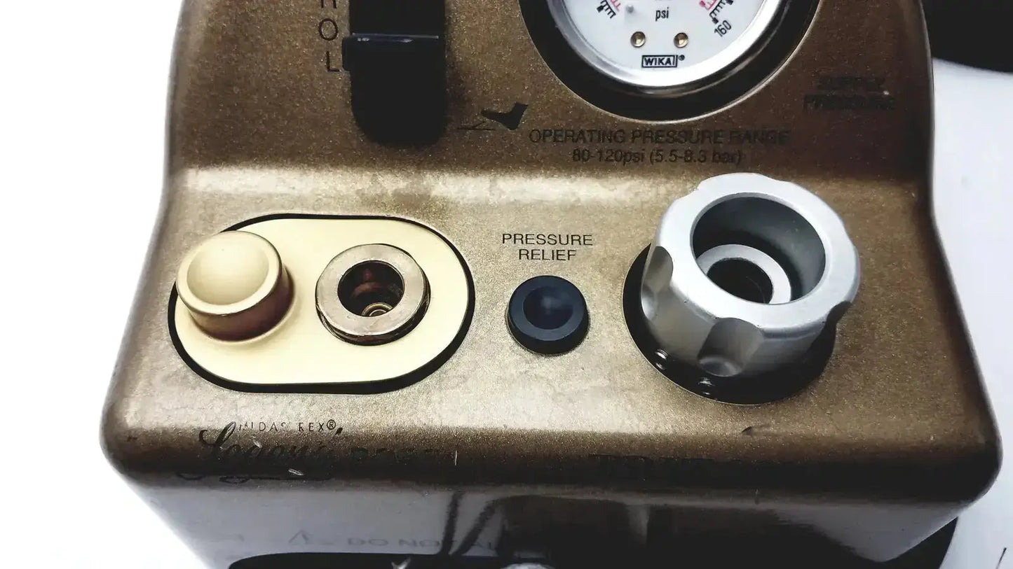 Vintage brass-colored industrial pressure gauge with black knob and silver fittings for midas rex legend gold pneumatic unit