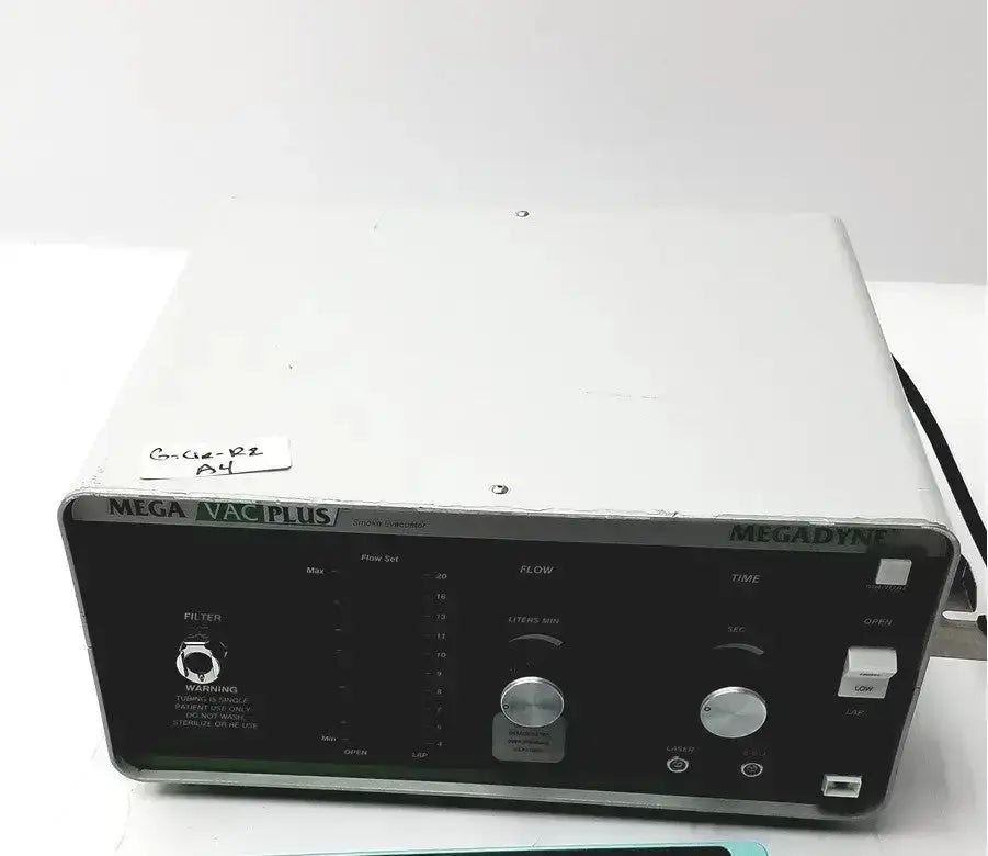 Silver and black megadyne mega vac-plus medical vacuum pump with control knobs dials and warning label front panel