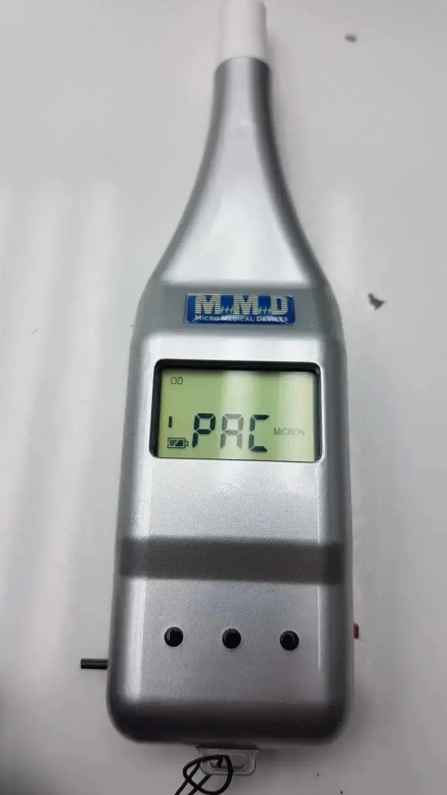 Silver handheld micro medical devices palmscan p2000 fastpach pachymeter with digital display showing 1 pac and brand label m.m.d