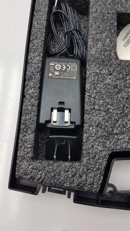 Black plastic power adapter with coiled cable and dual-prong plug for micro medical devices palmscan p2000 fastpach pachymeter