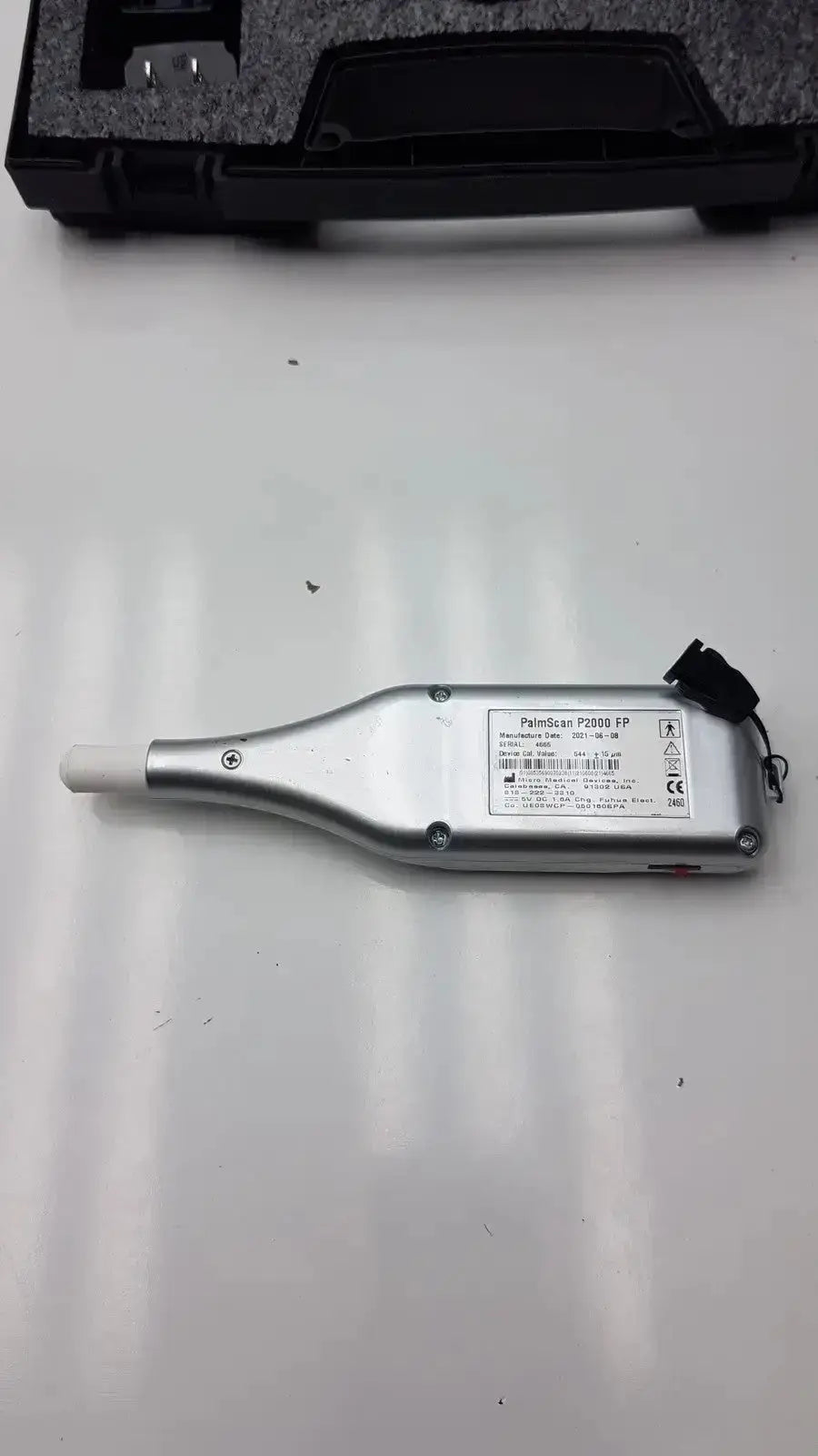 Silver micro medical devices palmscan p2000 fastpach pachymeter with white cylindrical probe tip and black cable attachment