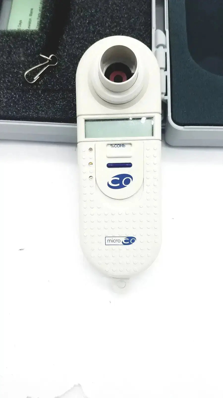Micro Medical MicroCO white handheld carbon monoxide monitor with digital display blue logo and textured grip surface