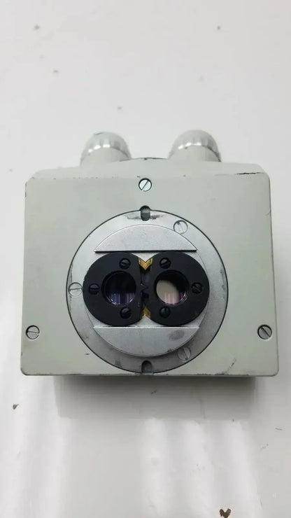 Silver metallic microscope binocular head p16x with two circular lens ports and cylindrical protrusions on top