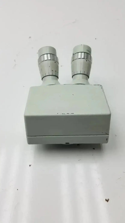 Light gray plastic microscope binocular head p16x with two silver-tipped eyepieces for enhanced viewing accuracy