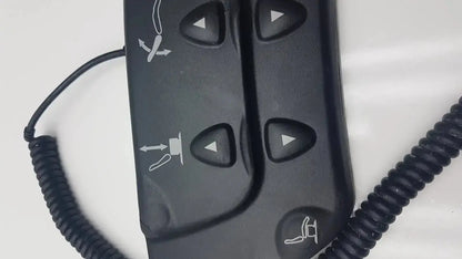 Black plastic midmark 647 podiatry chair foot control with directional buttons and function icons for chair foot control