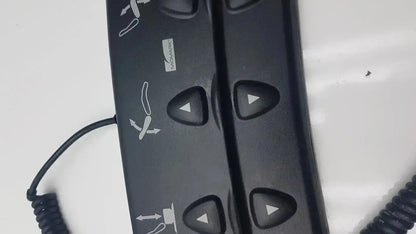 Black plastic podiatry chair foot control with triangular buttons and white directional icons for midmark 647 chair