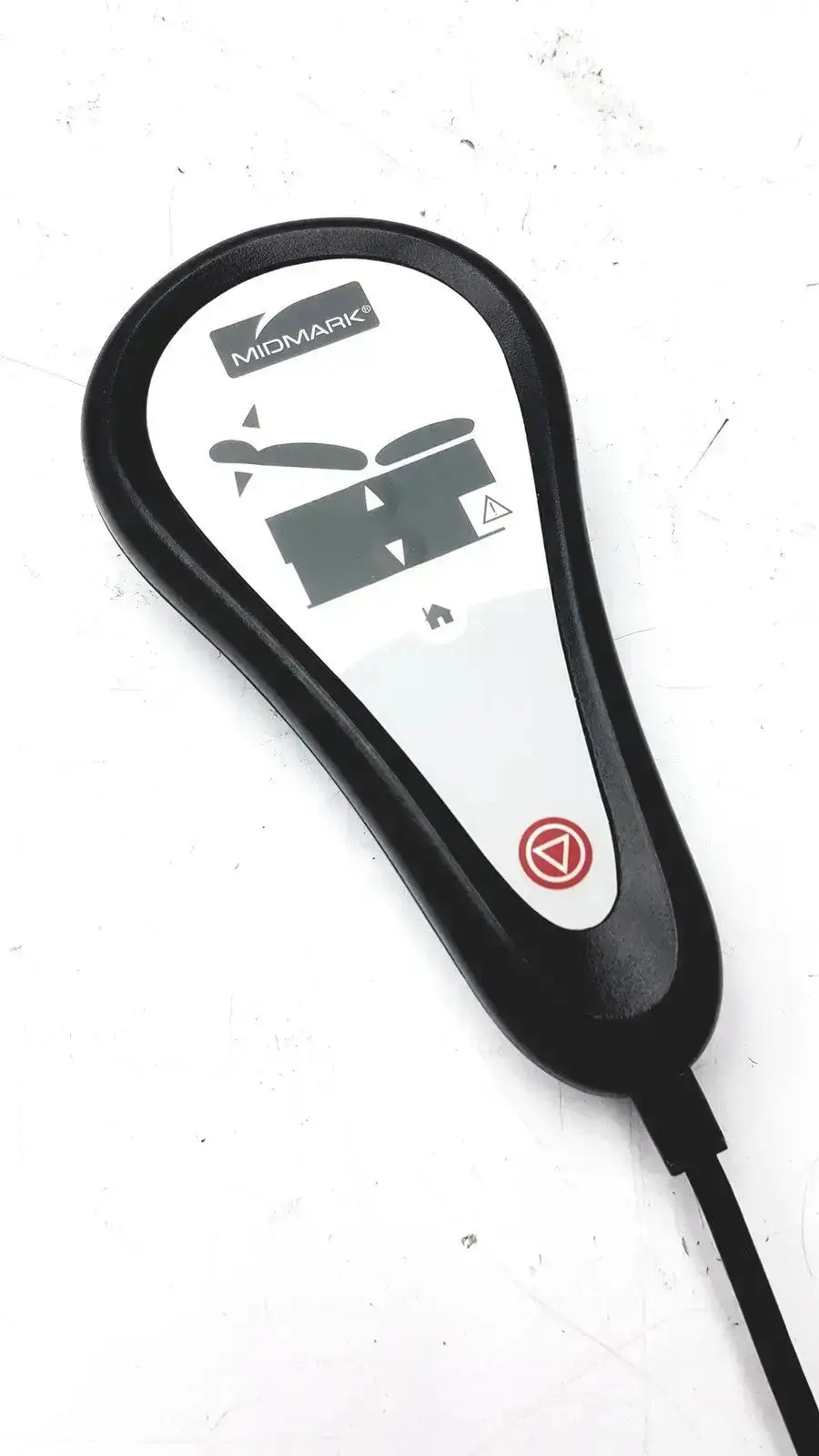 Black and white midmark exam table hand remote with digital display black plastic casing and attached cable