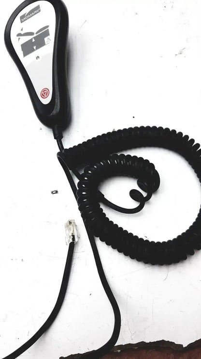 Black coiled telephone handset with white control panel and mosaic branding for midmark exam table hand remote control