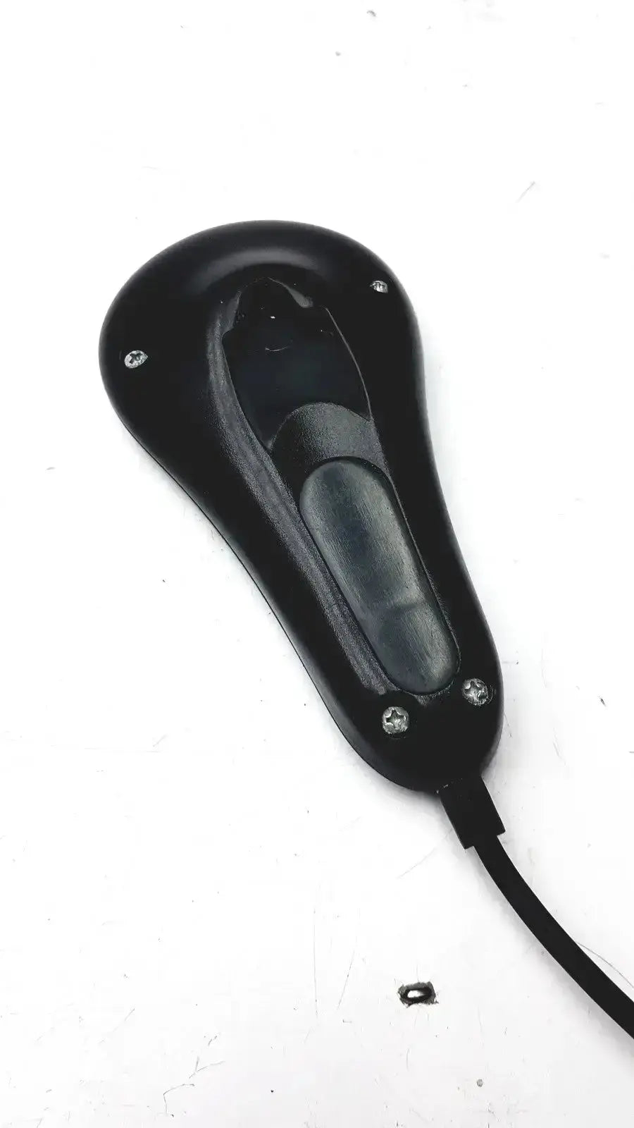 Black plastic midmark exam table hand remote with glossy finish and four silver screws on the back side