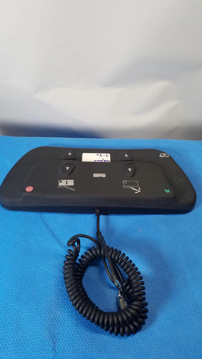 Black ergonomic midmark qe ipx1 wired foot controller foot pedal with coiled cable and directional buttons for medical equipment