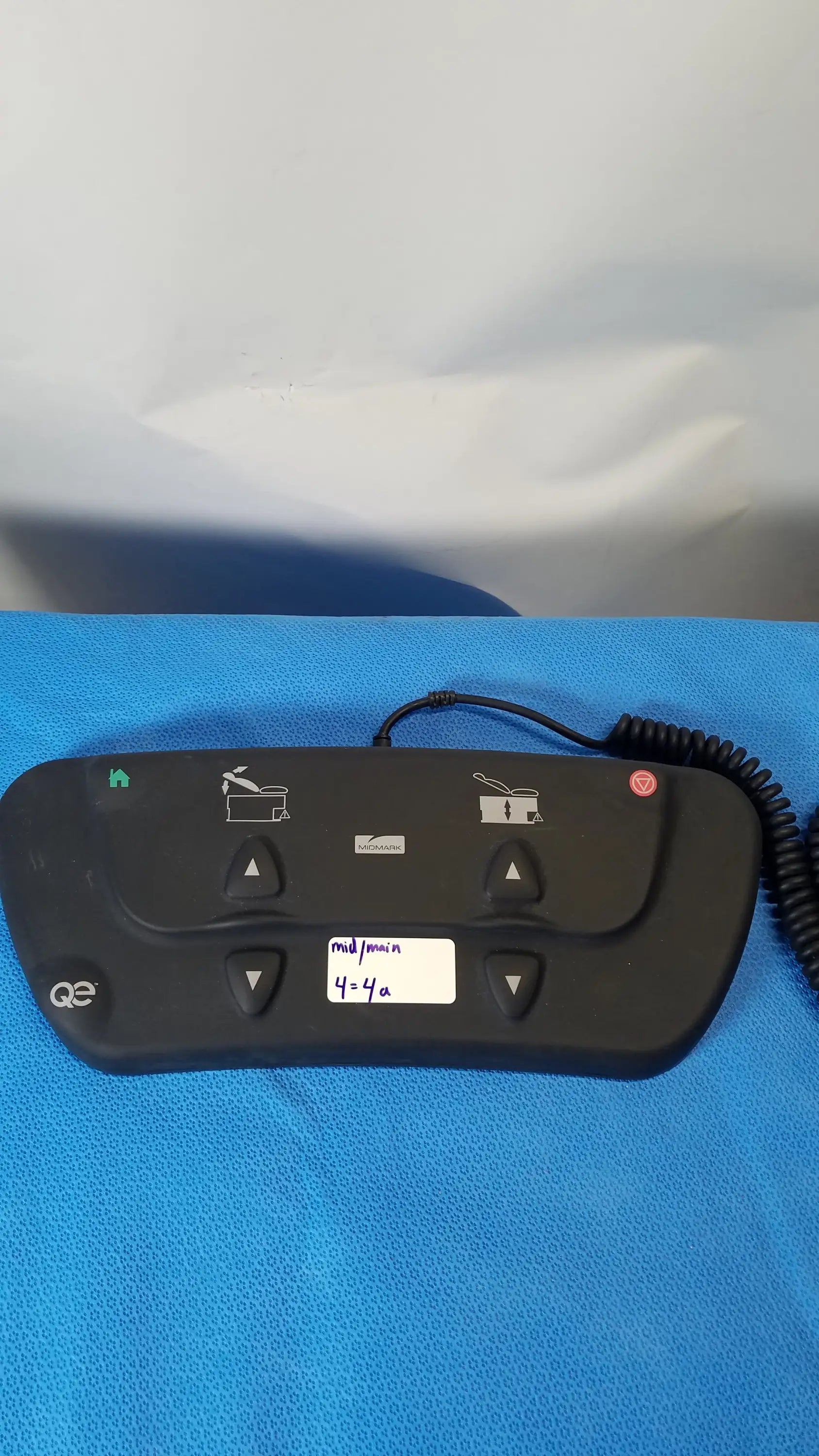 Black q3 medical control panel with tactile buttons and coiled cable for midmark qe ipx1 wired foot controller medical equipment