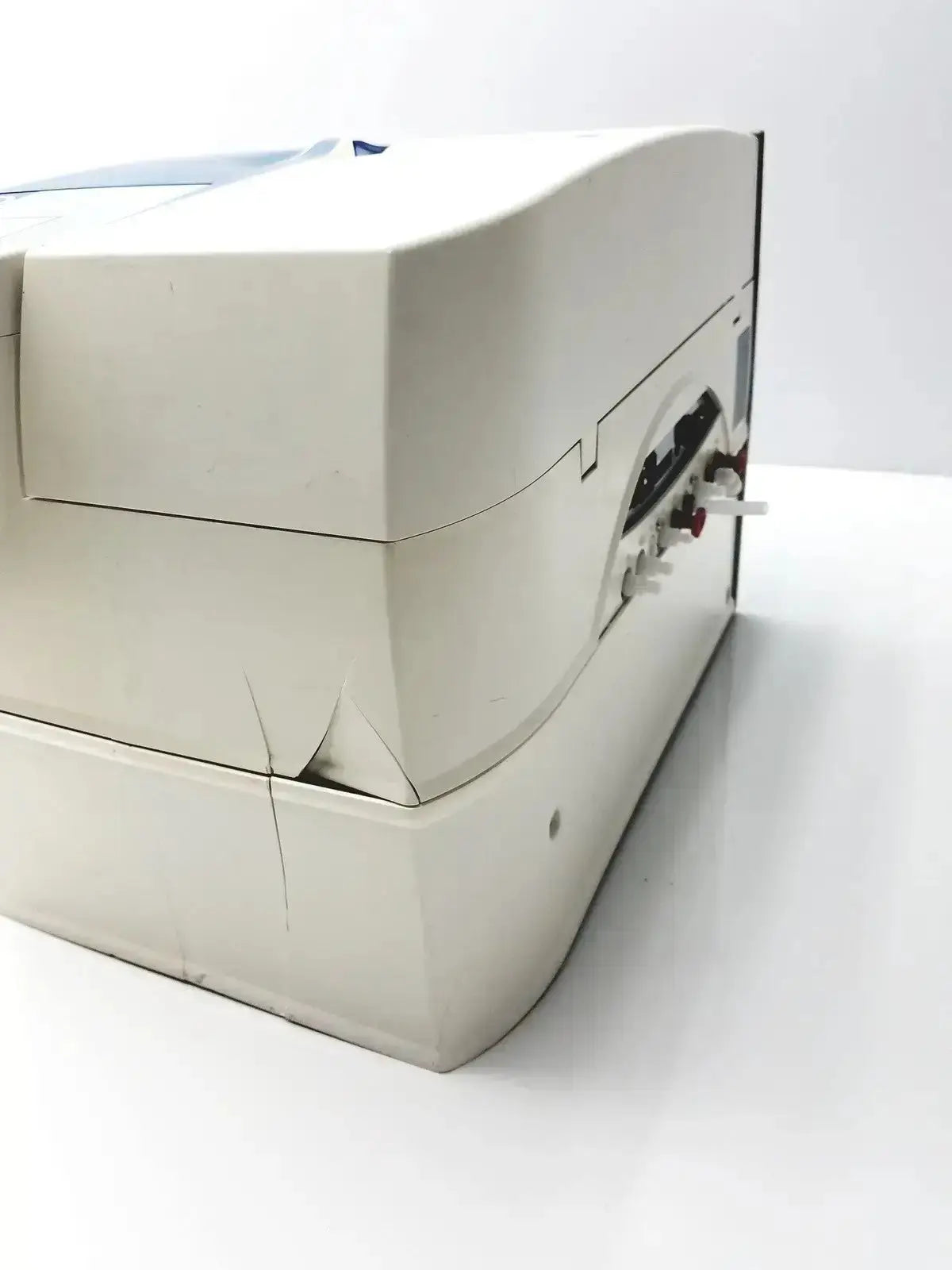Off-white plastic millipore milli-q advantage a10 toc monitor with curved top and side panel featuring black knobs and connectors