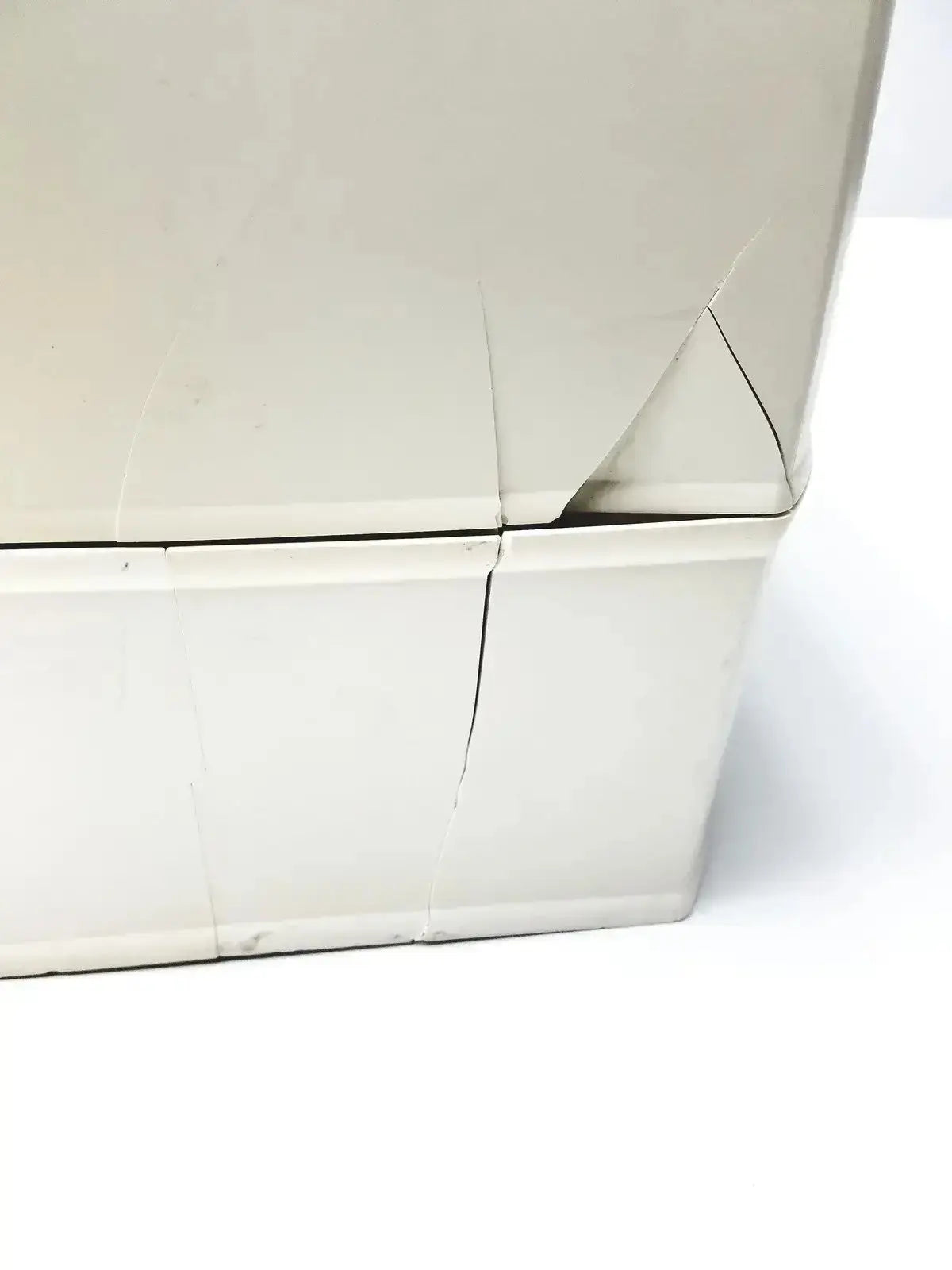 Beige cardboard box with creases and a torn corner for millipore milli-q advantage a10 toc monitor packaging