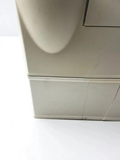 Beige plastic millipore milli-q advantage a10 toc monitor with curved top and visible crack along its base