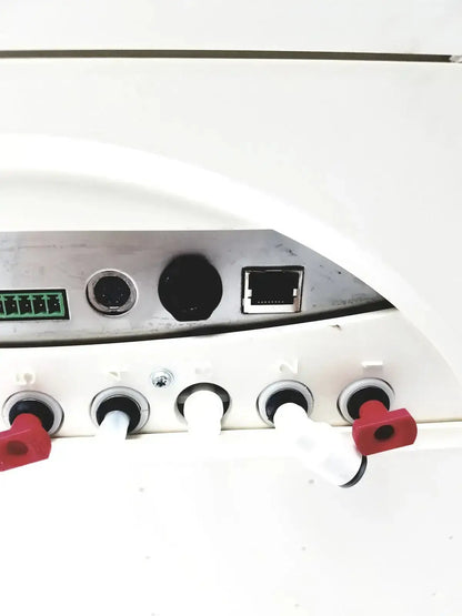 White plastic control panel with red knobs and silver ethernet port on millipore milli-q advantage a10 toc monitor
