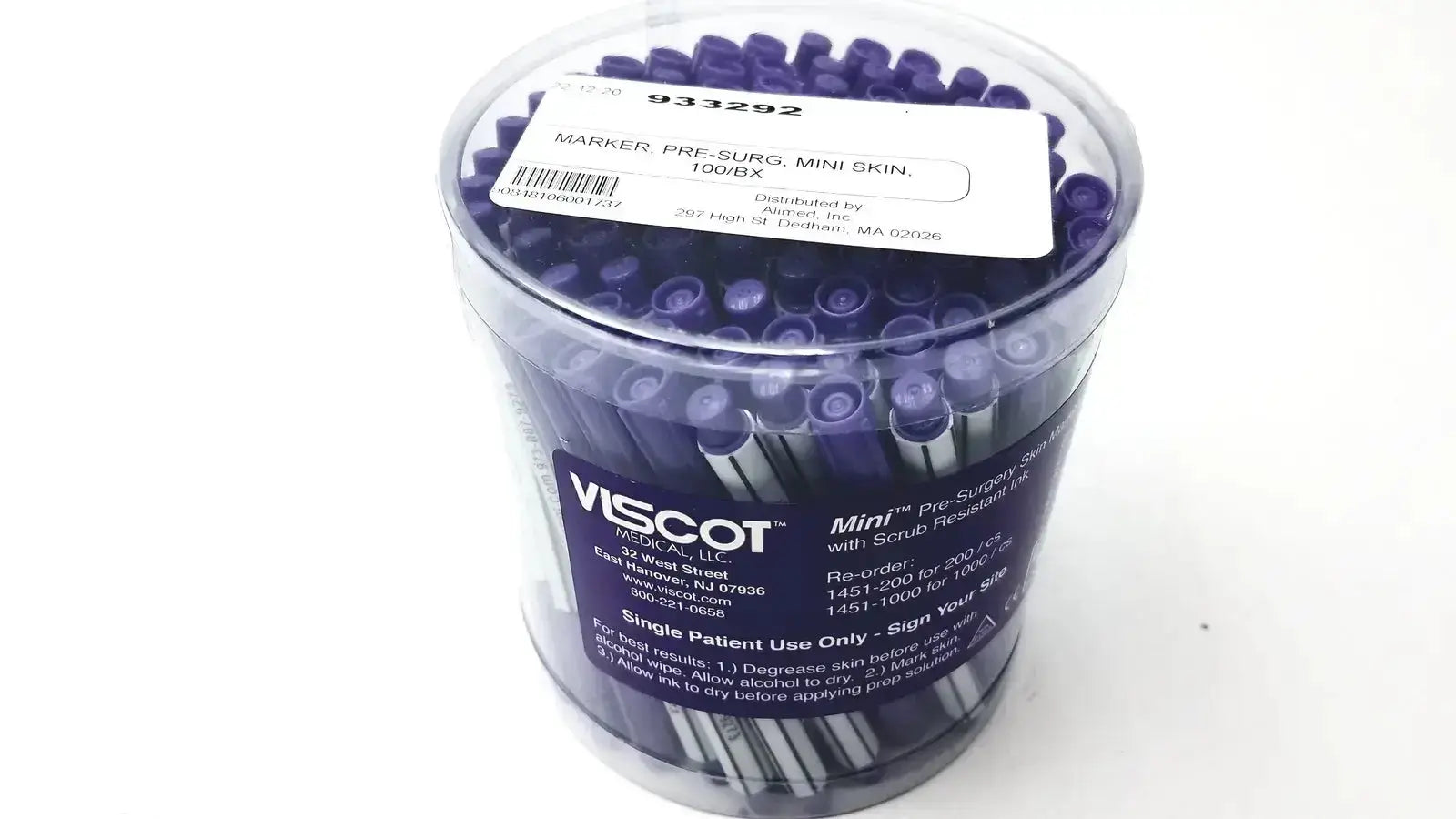 A clear plastic container with mini pre-surgery skin markers featuring purple tips black bodies and scurb resistant ink