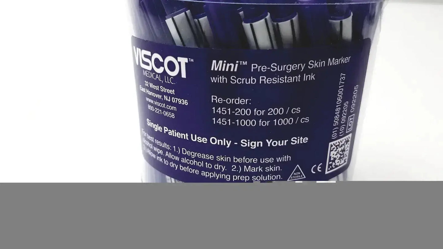 Blue plastic container holding multiple mini pre-surgery skin markers with scurb resistant ink for medical use