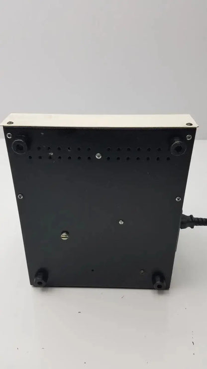 Black rectangular MJ Research ptc-100 programmable thermal controller with white vented top panel and four black feet