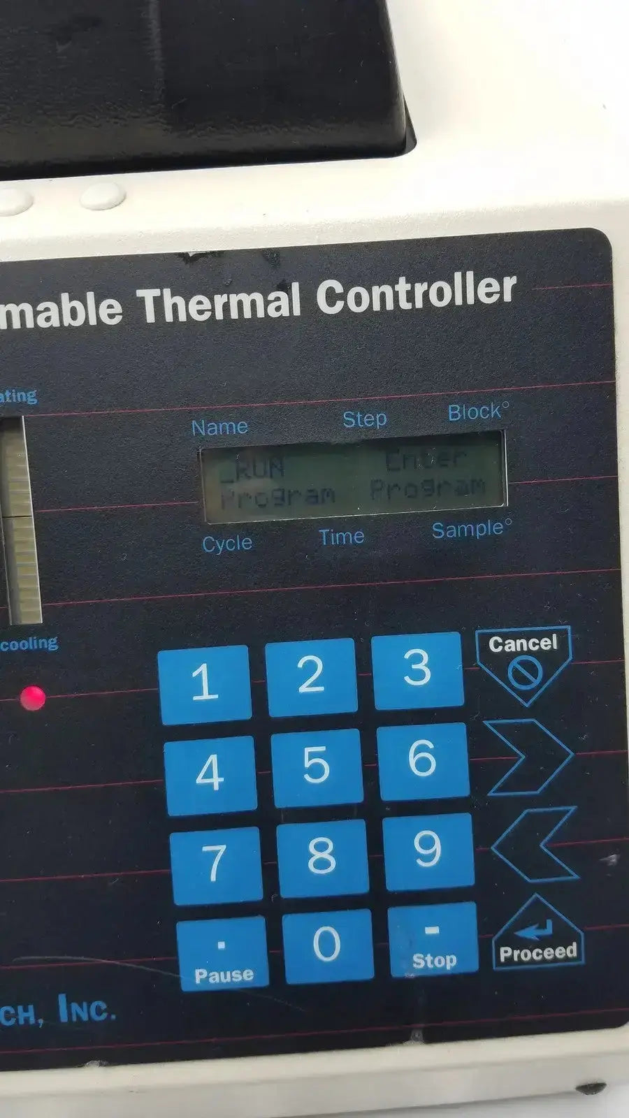 Black digital keypad panel with blue buttons and white text on mj research ptc-100 programmable thermal controller