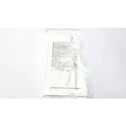 A white, sterile medical gauze pad sealed in a clear plastic package with printed instructions and the number ’7’’ visible.