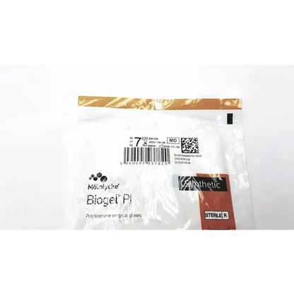 Sterile, white mönlycke biogel pl polyisoprene surgical gloves in a clear plastic package with gold-sealed top.