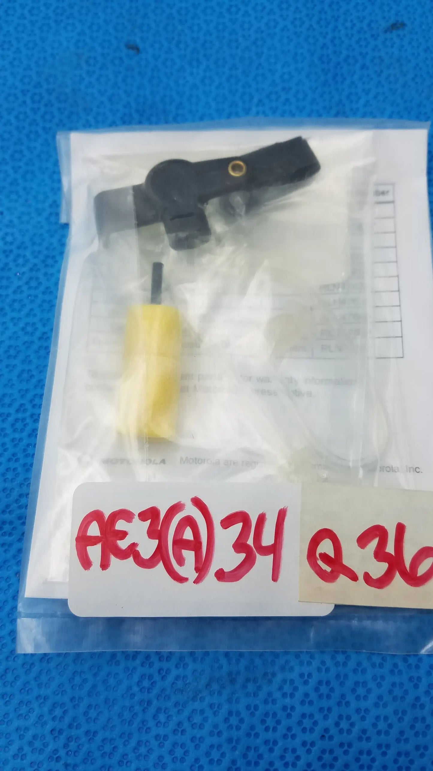Black plastic car sensor with yellow cylindrical component in clear packaging for motorola rln6230a extreme noise kit