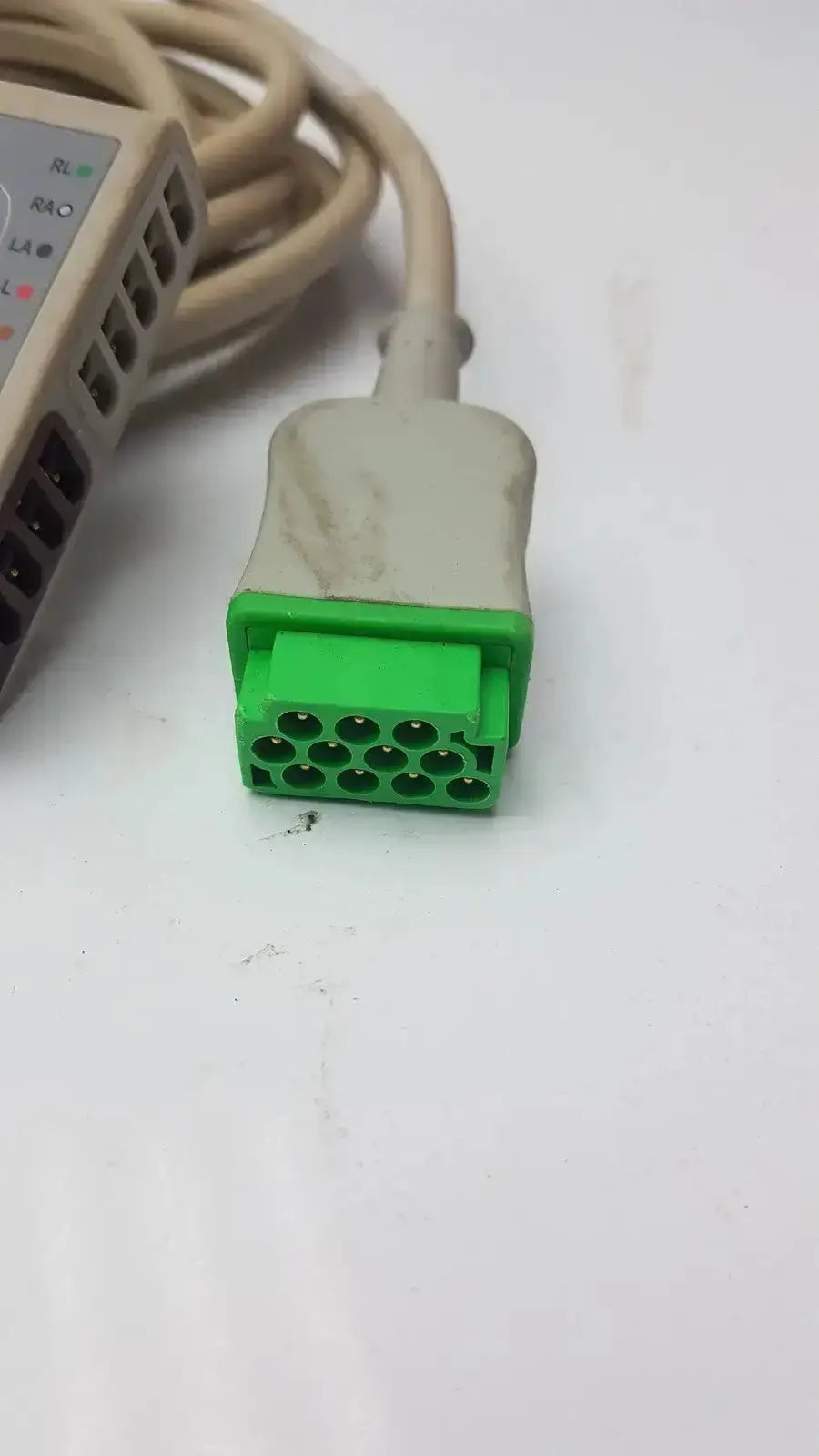 Green and beige multi-link ecg ttrunk cable by ge with 16-pin diagnostic connector for medical use